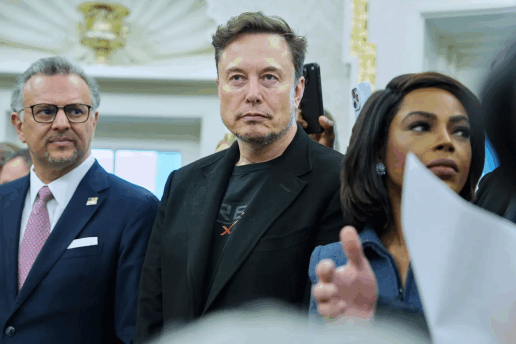 Elon Musk looks on as President Donald Trump meets South African President Cyril Ramaphosa in the Oval Office of the White House on May 21 in Washington, DC. (AP Photo)