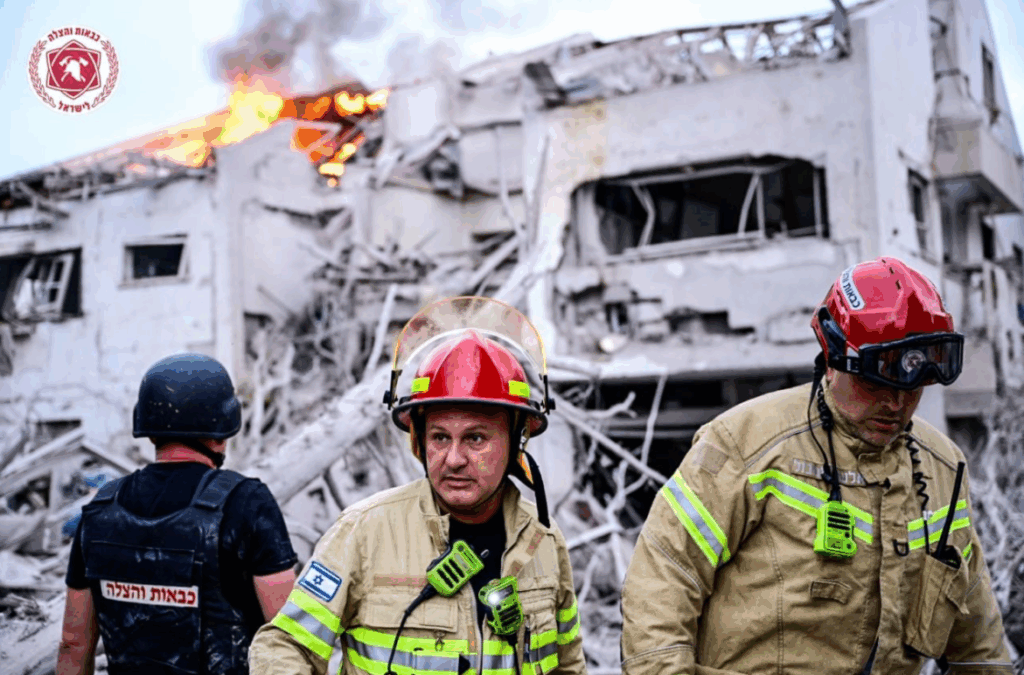 Israel Fire and Rescue works the scene of an Iranian missile strike in Rishon Lezion, Israel, on Saturday.