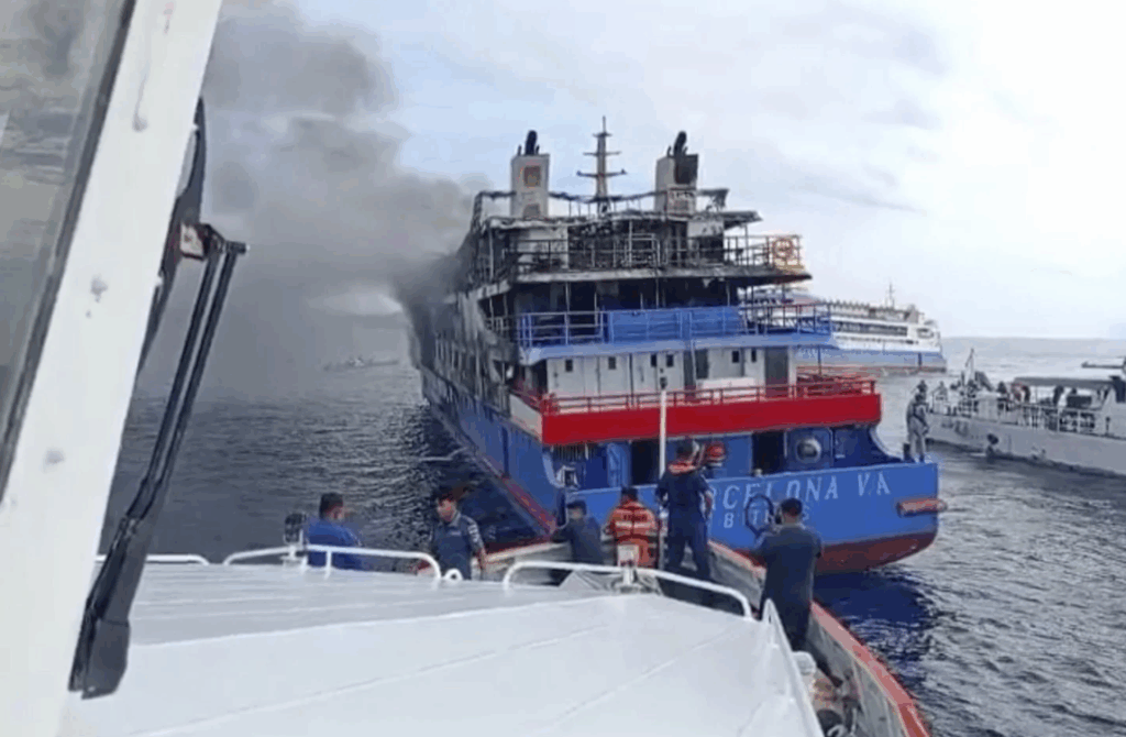 In this photo made from video released by the Indonesian National Search and Rescue Agency (BASARNAS), rescue ship approach passenger ship KM Barcelona after it caught fire in the waters off Talise Island in North Sulawesi, Indonesia, Sunday, July 20, 2025. 
